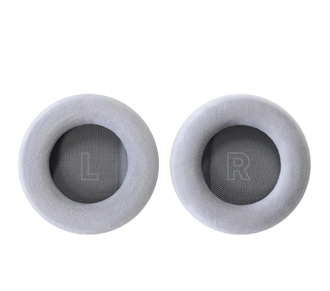 A pair of light gray replacement over-ear headphone ear cushions, shown from the inside with 'L' and 'R' markings on the mesh.