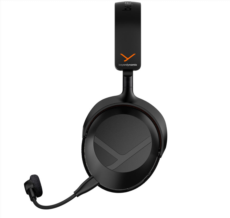 A black over-ear gaming headset with an attached microphone, featuring the beyerdynamic logo in orange on the headband and a matching logo on the ear cup.